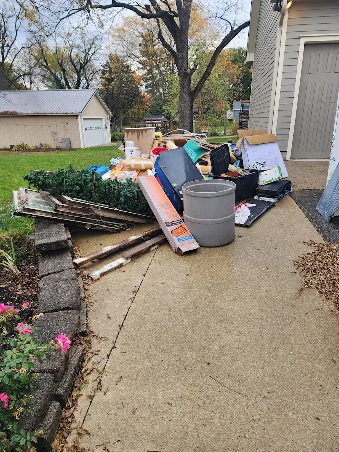 Dumpster being loaded with debris for 30 Yard Dumpster Rental in Kingsport